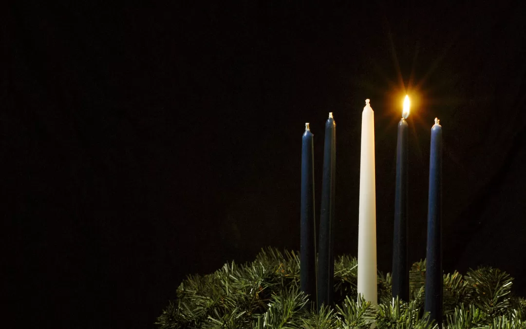 Single candle lit on the Advent wreath